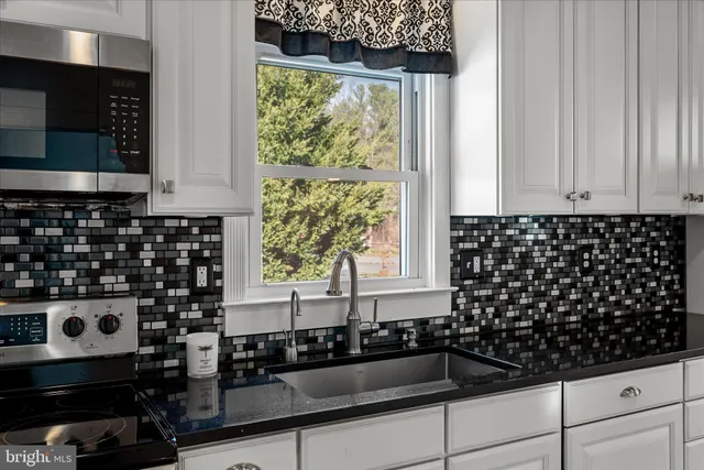 a view of a room with wooden floor and window