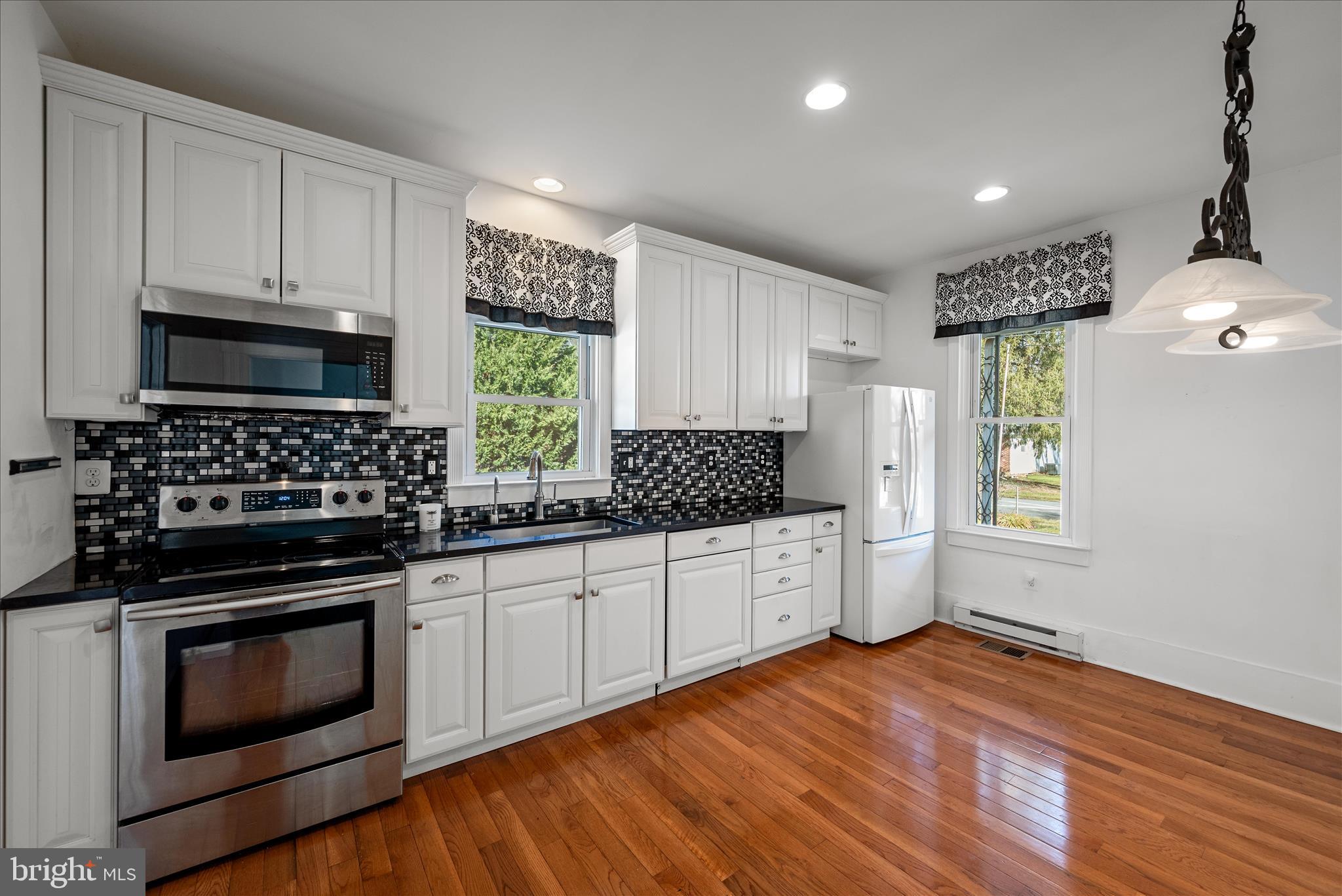 129 Church Street Summit Point, WV 25446 - Photo 43 of 91 Remodeled Kitchen with Hardwood Floors