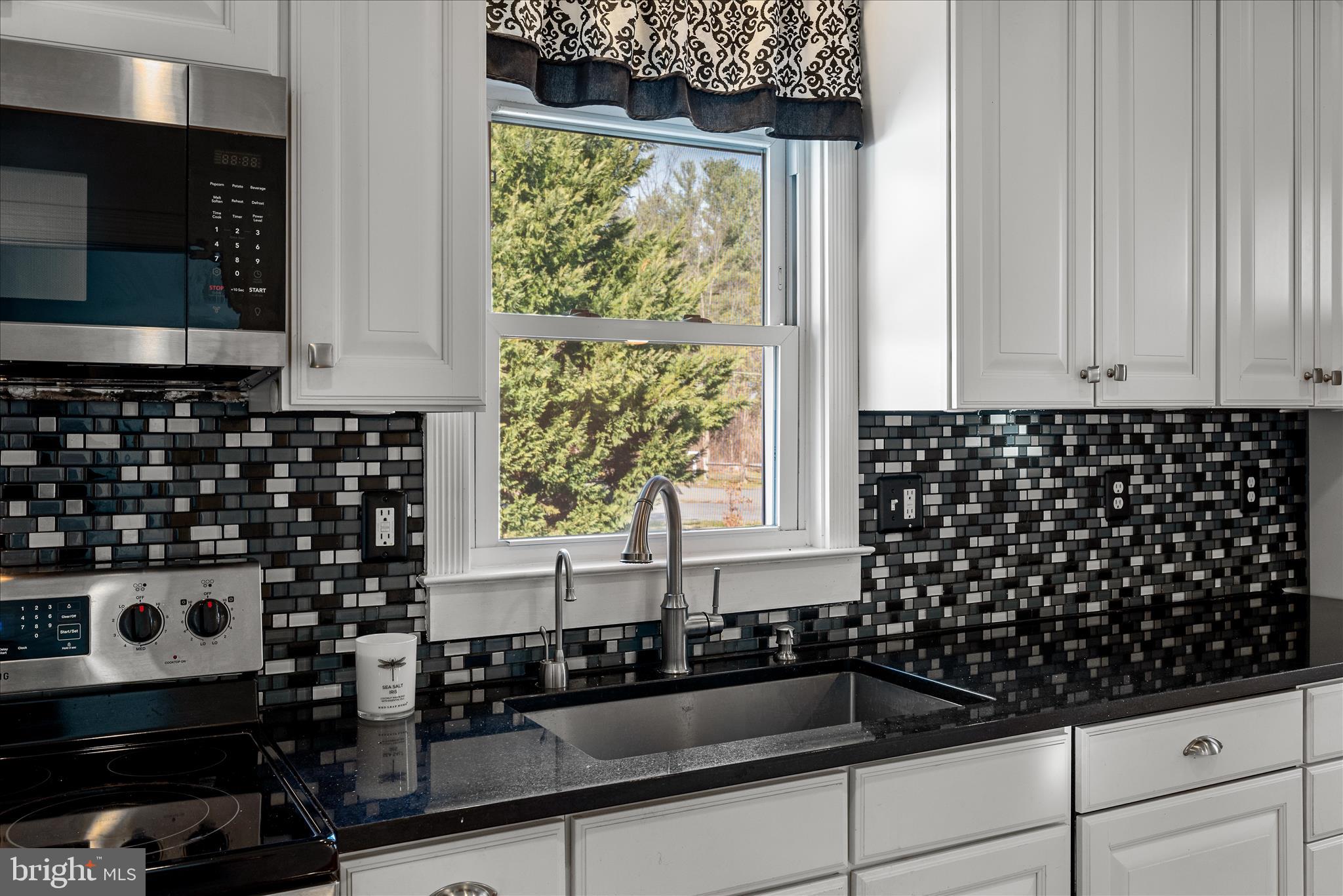129 Church Street Summit Point, WV 25446 - Photo 47 of 91 a kitchen with a sink and cabinets