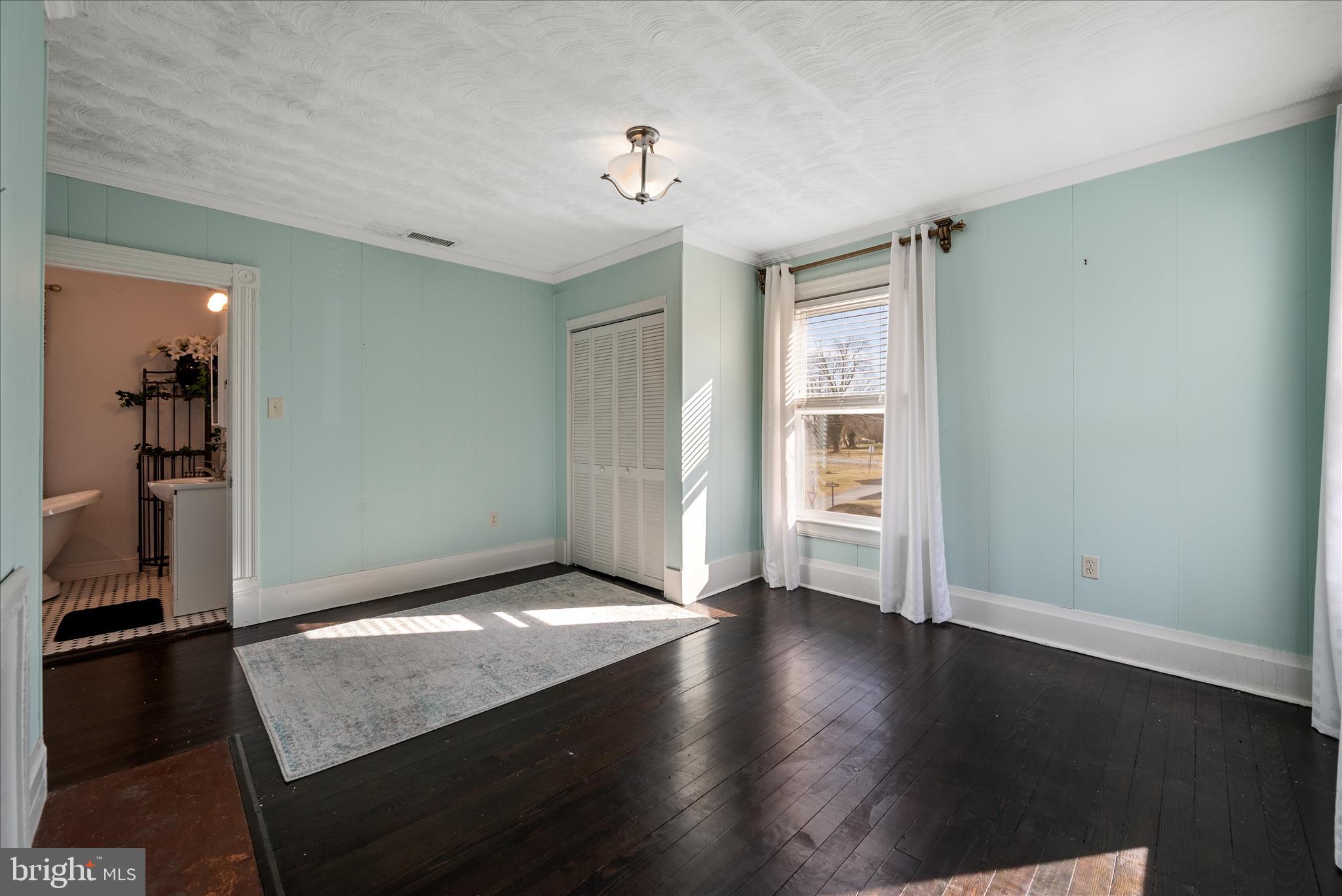 129 Church Street Summit Point, WV 25446 - Photo 62 of 91 wooden floor in an empty room with a window