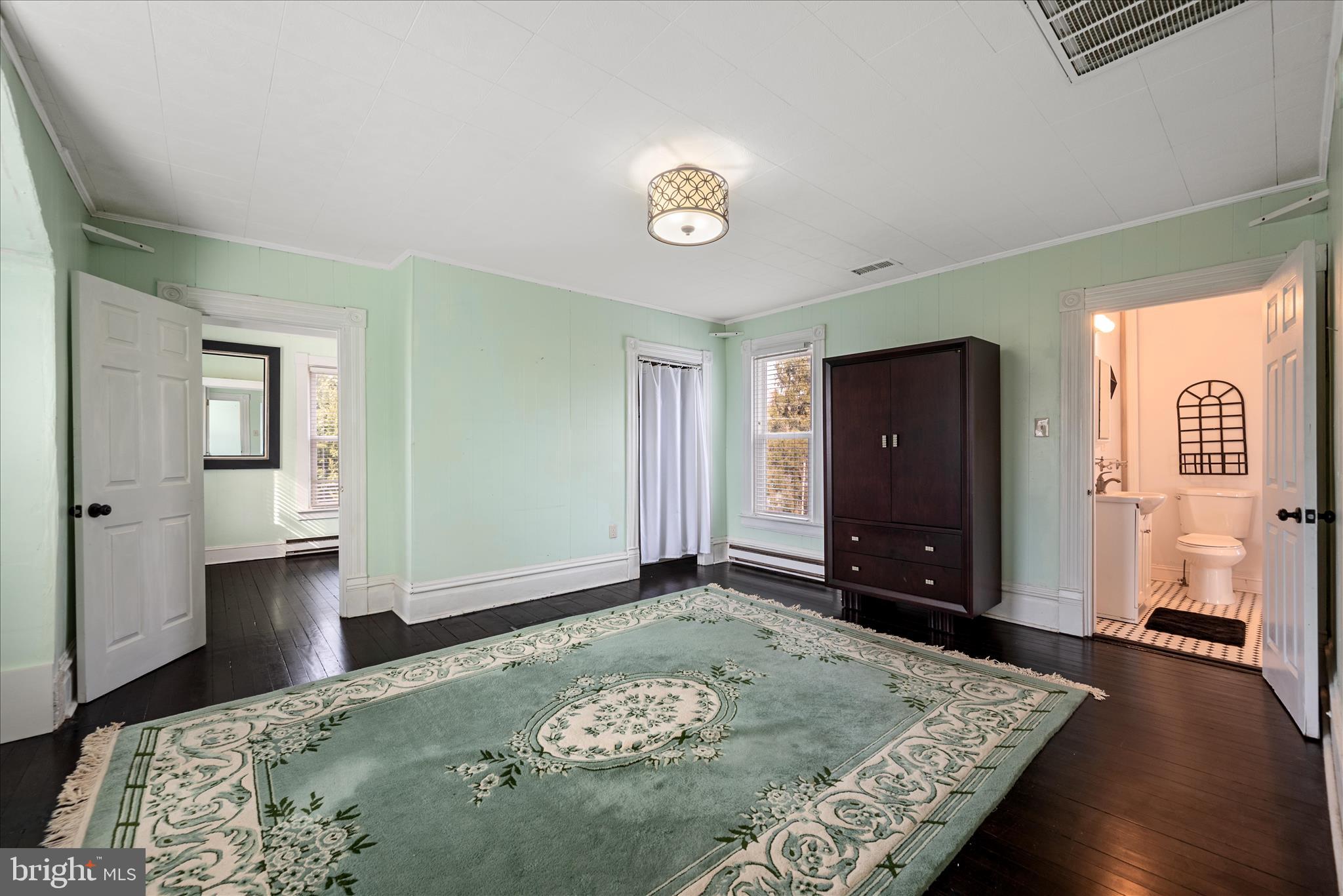 129 Church Street Summit Point, WV 25446 - Photo 63 of 81 a view of a bedroom with wooden floor and window