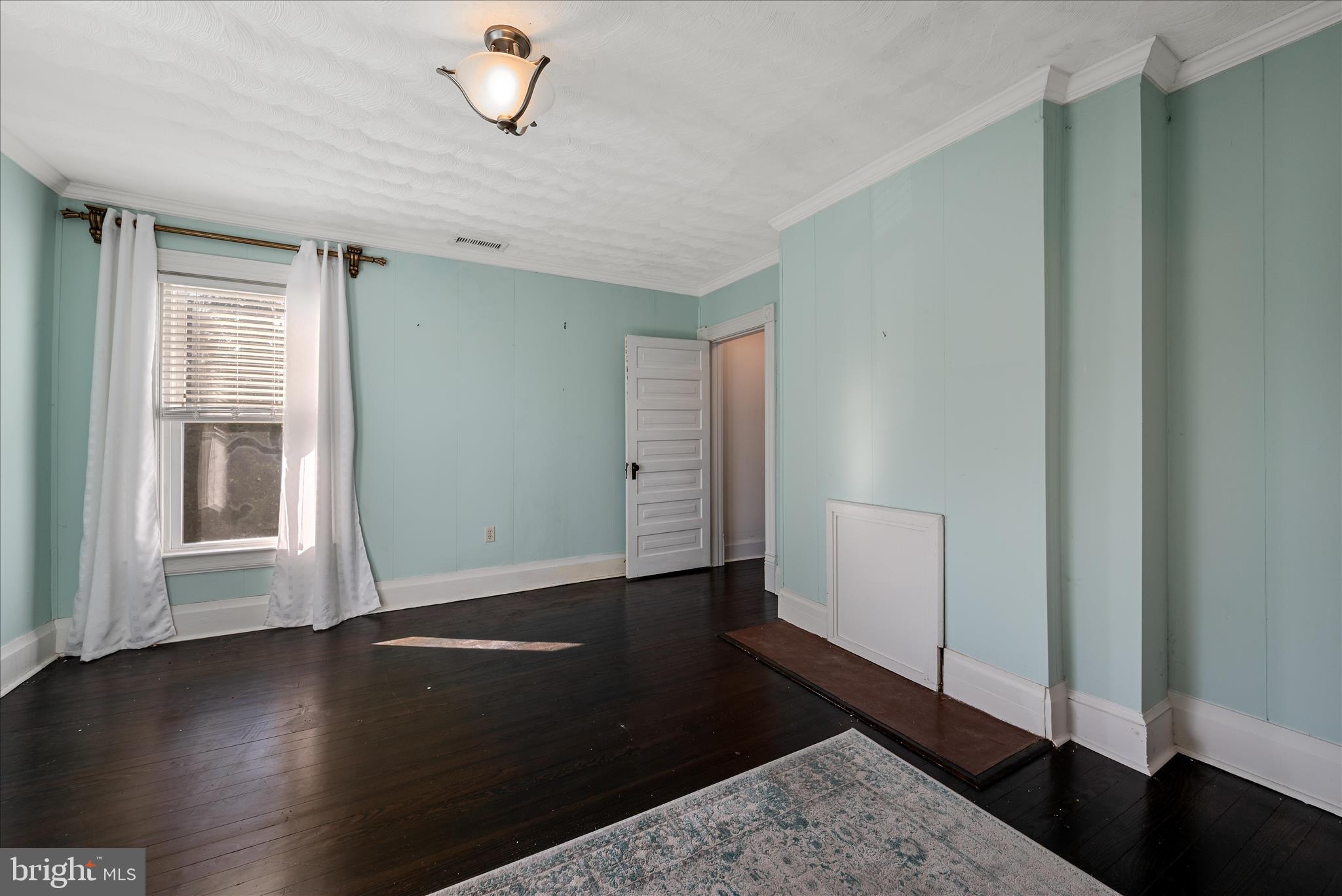 129 Church Street Summit Point, WV 25446 - Photo 63 of 91 a view of empty room with wooden floor and fan