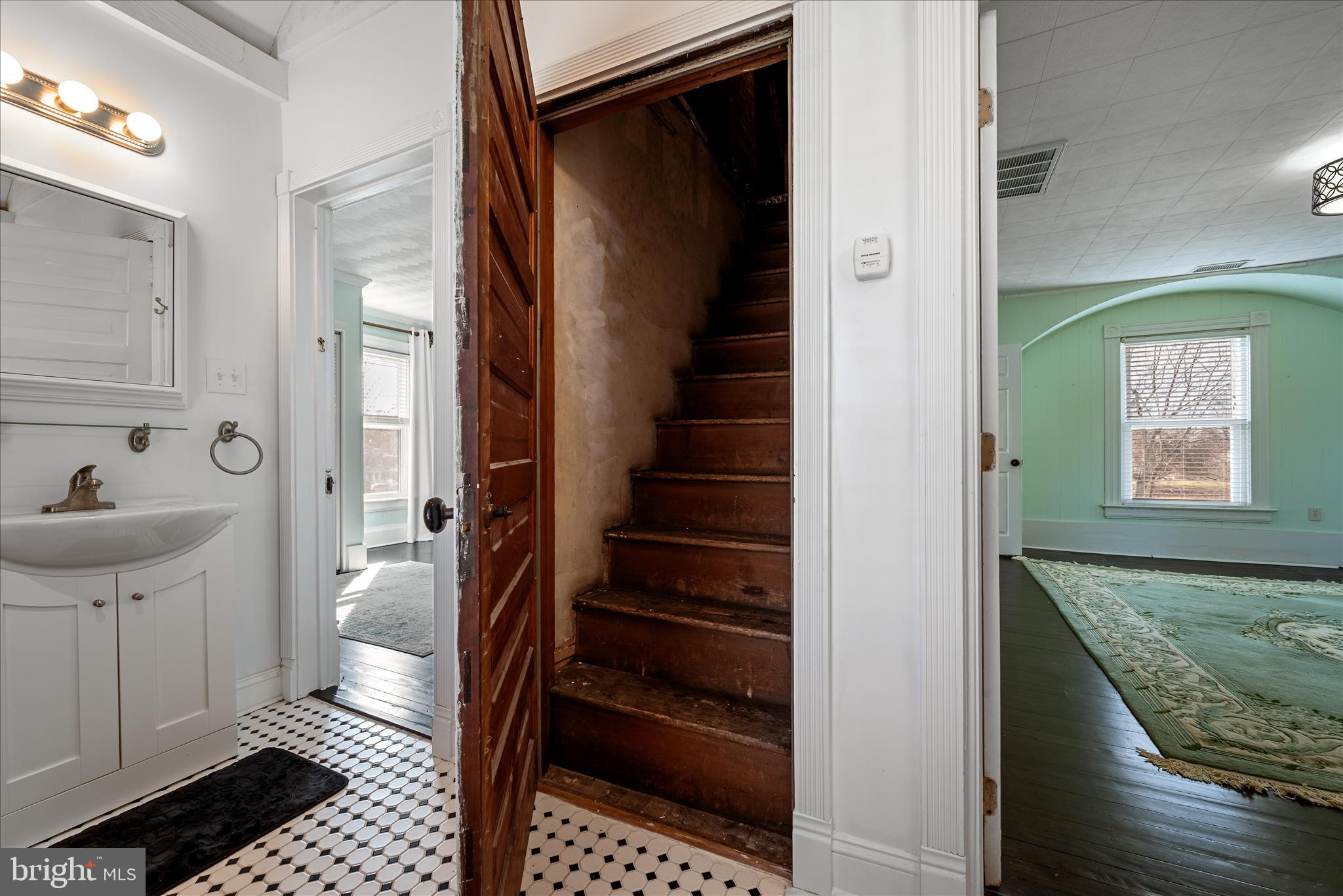129 Church Street Summit Point, WV 25446 - Photo 67 of 81 a view of a hallway with wooden floor and staircase