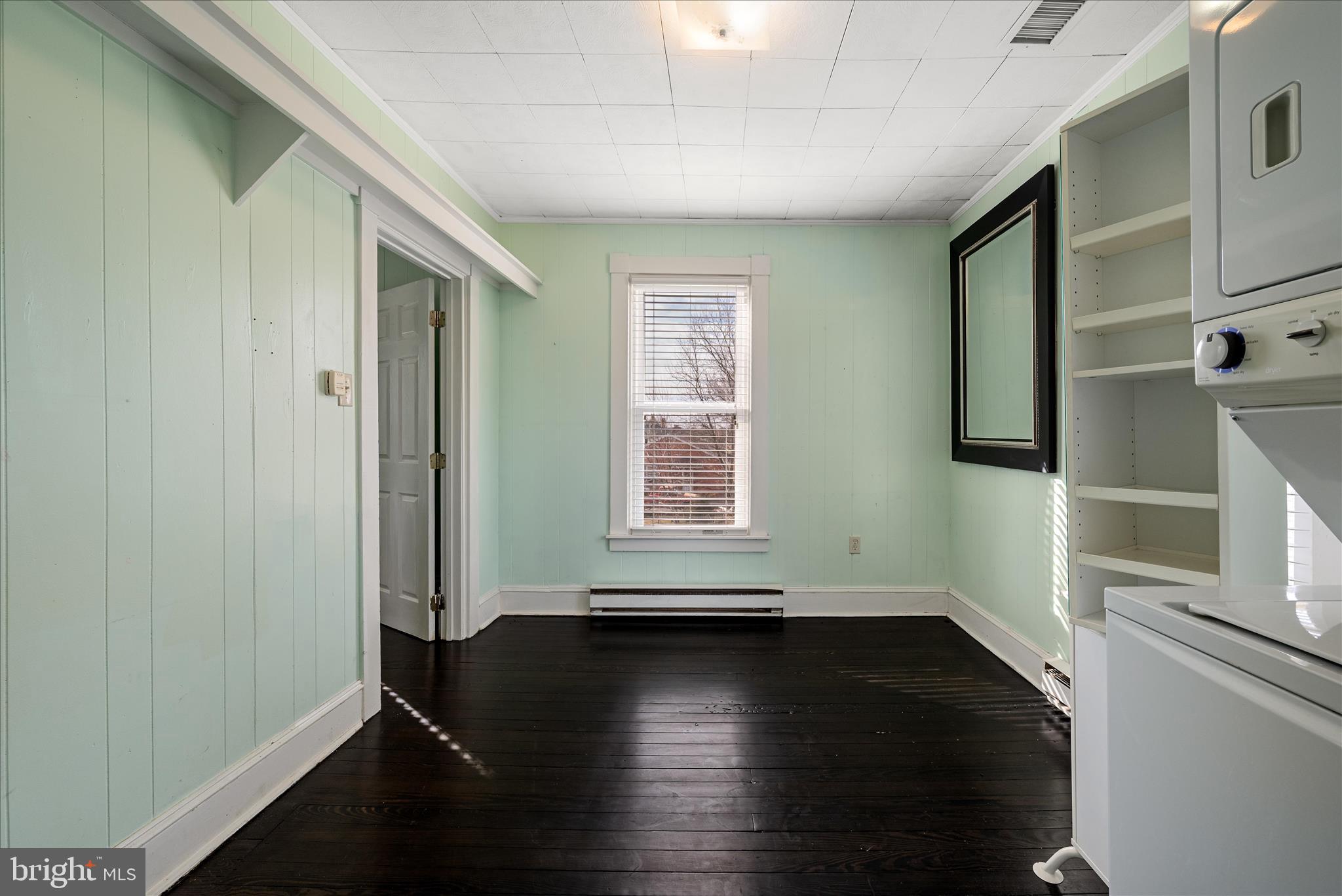 129 Church Street Summit Point, WV 25446 - Photo 76 of 91 a view of a livingroom with wooden floor and a window
