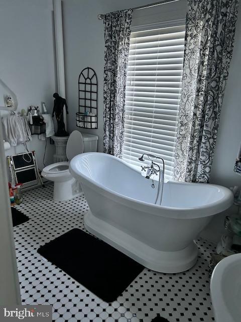 129 Church Street Summit Point, WV 25446 - Photo 76 of 81 a bathroom with a bathtub a sink and a toilet