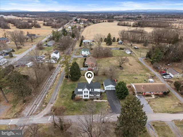 a view of backyard with barn and green space
