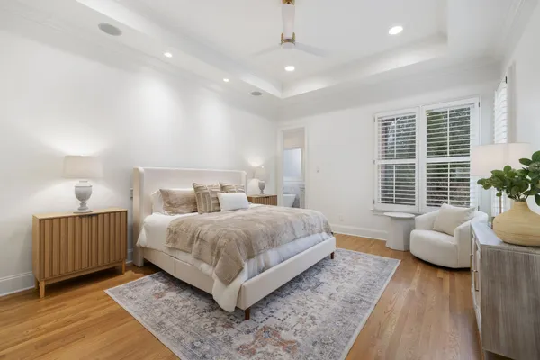 a spacious bedroom with a bed and a couch