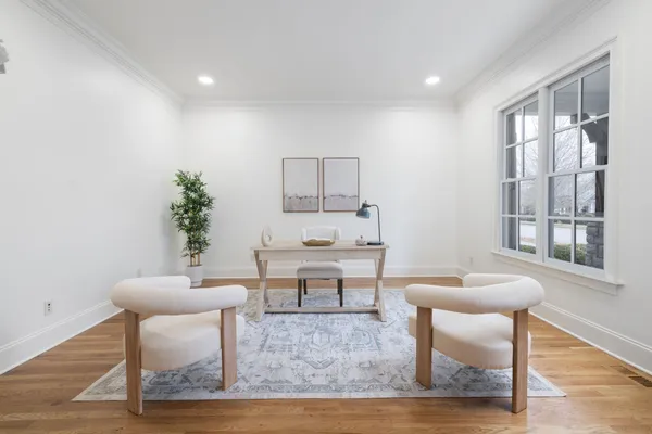 a view of a dining room with furniture window and wooden floor