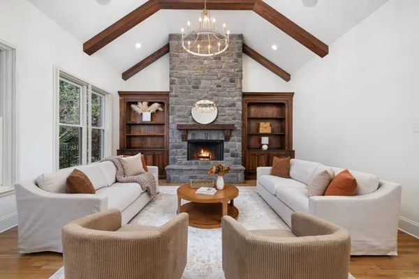 a living room with furniture and a fireplace
