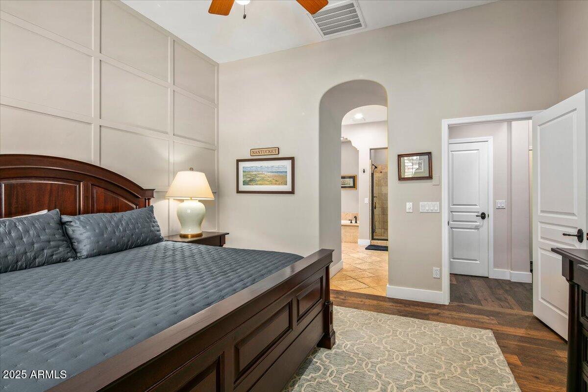 20704 North 90th Place, Unit 1004 Scottsdale, AZ 85255 - Photo 17 of 28 a bedroom with a bed and dresser