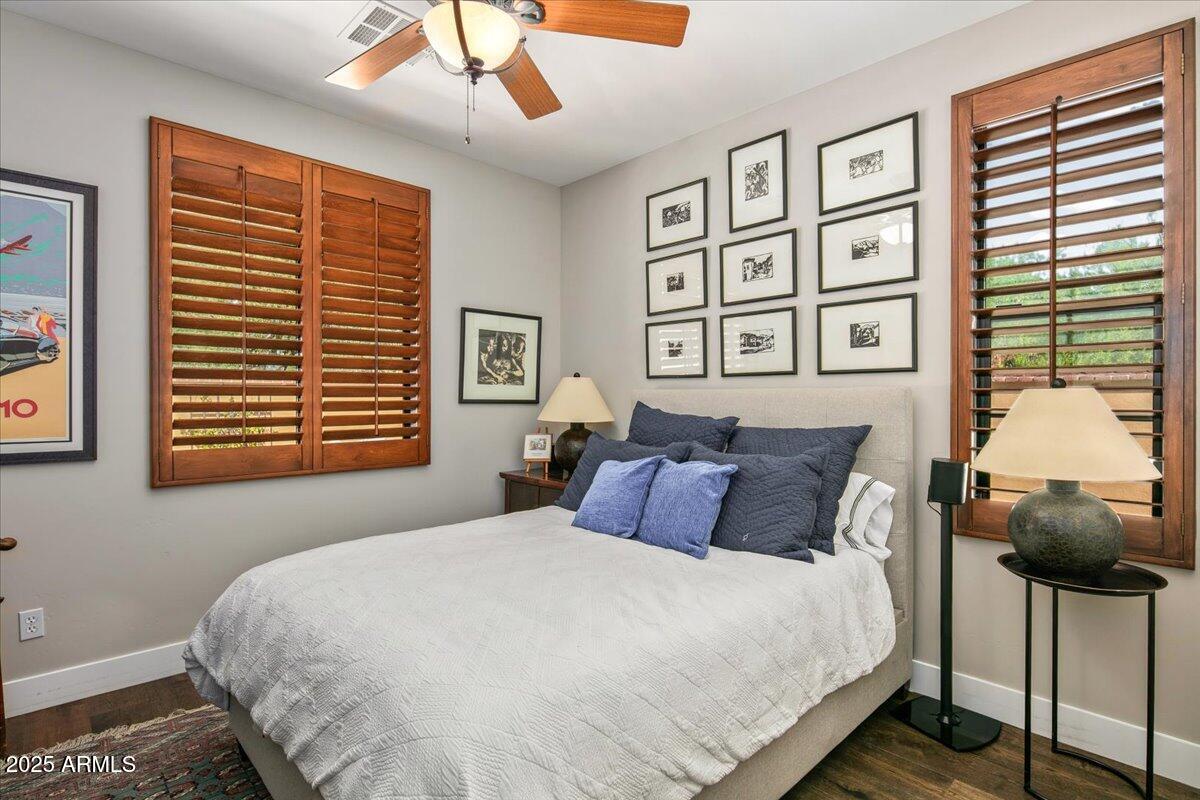 20704 North 90th Place, Unit 1004 Scottsdale, AZ 85255 - Photo 20 of 28 a bedroom with a large bed and a window