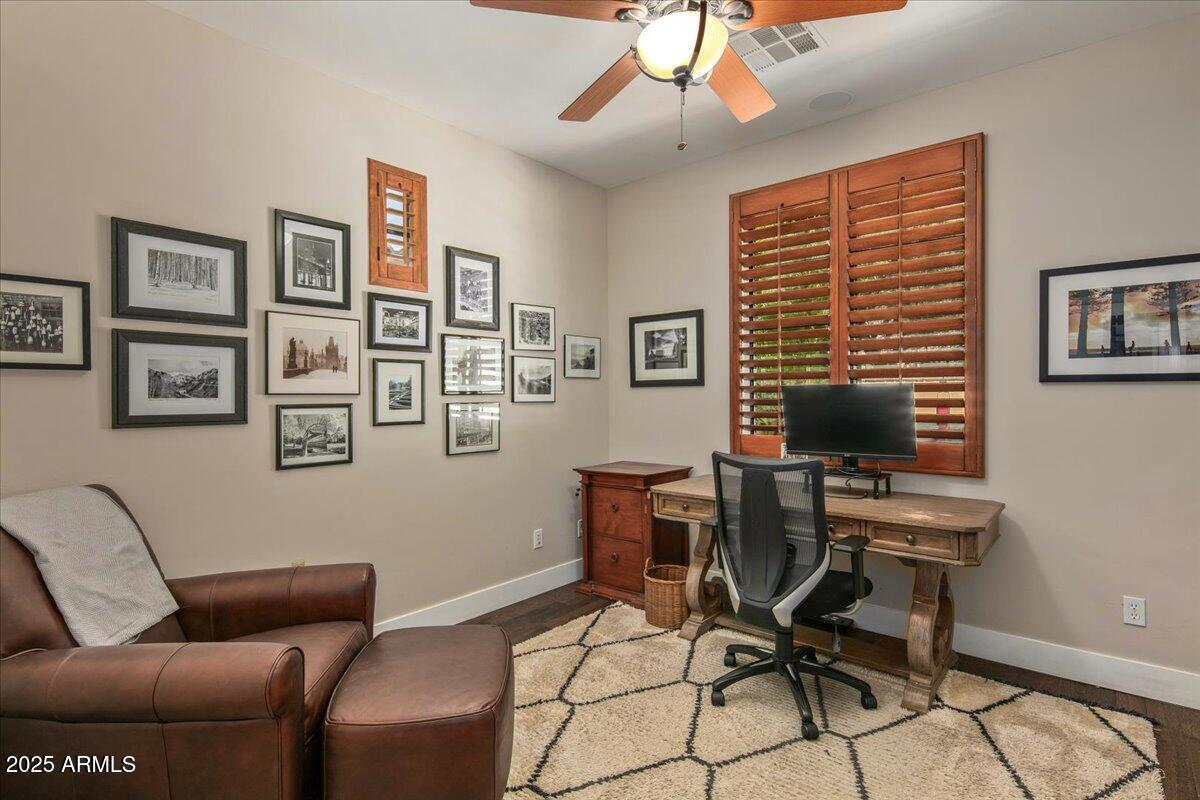 20704 North 90th Place, Unit 1004 Scottsdale, AZ 85255 - Photo 21 of 28 a view of a livingroom with workspace and a couch