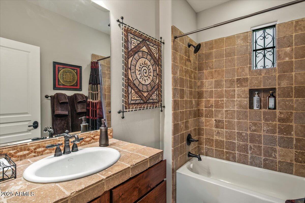 20704 North 90th Place, Unit 1004 Scottsdale, AZ 85255 - Photo 22 of 28 a bathroom with a sink and a mirror