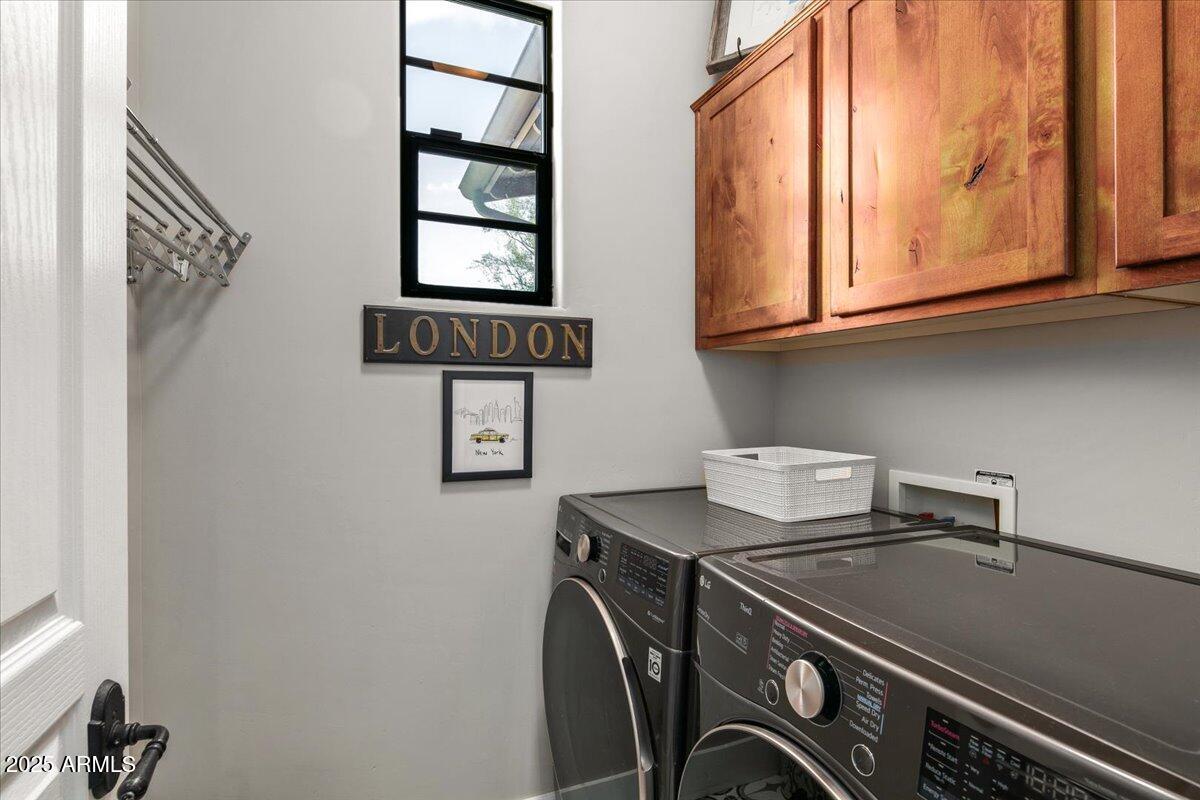 20704 North 90th Place, Unit 1004 Scottsdale, AZ 85255 - Photo 23 of 28 a utility room with dryer and washer