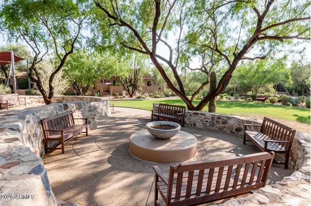 a view of front door of house with outdoor seating