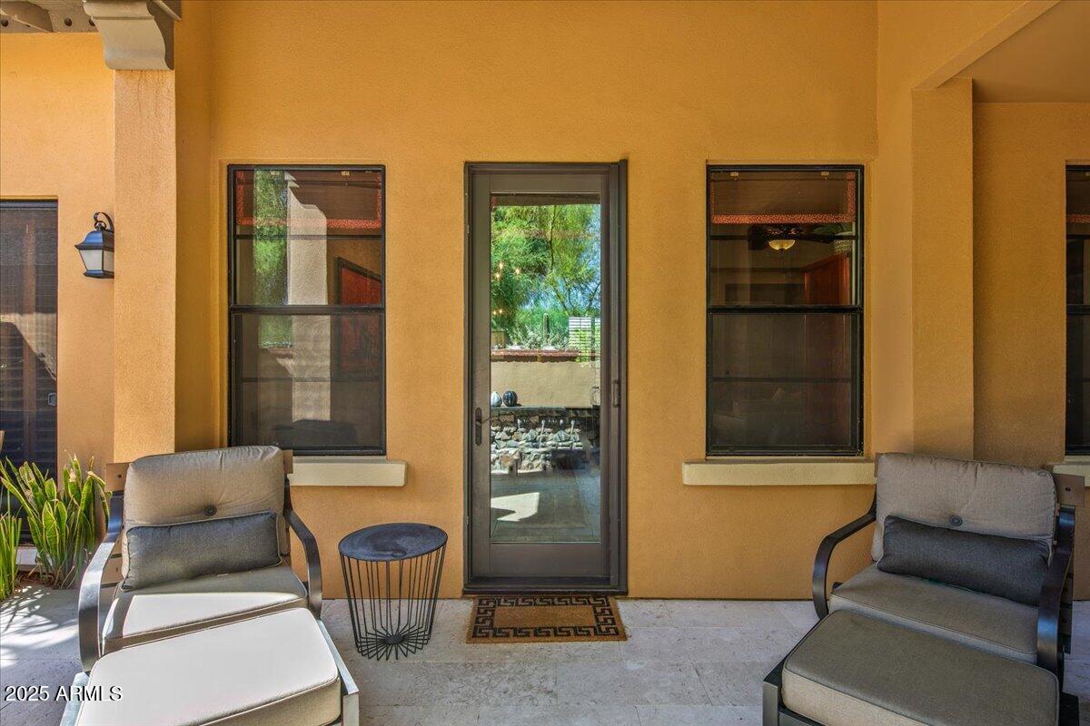 20704 North 90th Place, Unit 1004 Scottsdale, AZ 85255 - Photo 28 of 28 a view of front door of house with outdoor seating