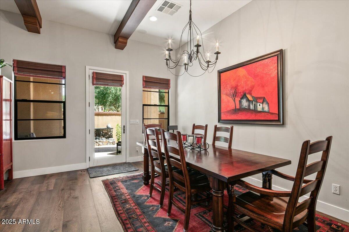 20704 North 90th Place, Unit 1004 Scottsdale, AZ 85255 - Photo 5 of 28 a view of a dining room with furniture window and wooden floor