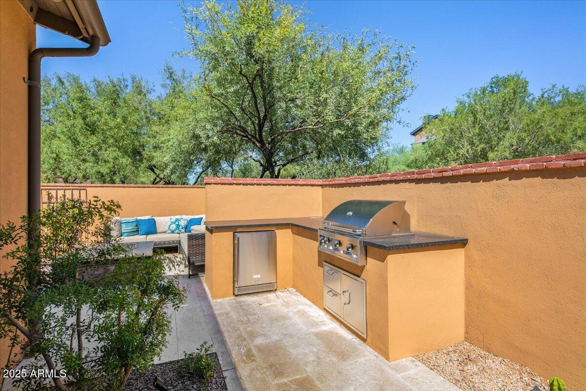 20704 North 90th Place, Unit 1004 Scottsdale, AZ 85255 - Photo 9 of 28 a view of outdoor space and barbecue grill