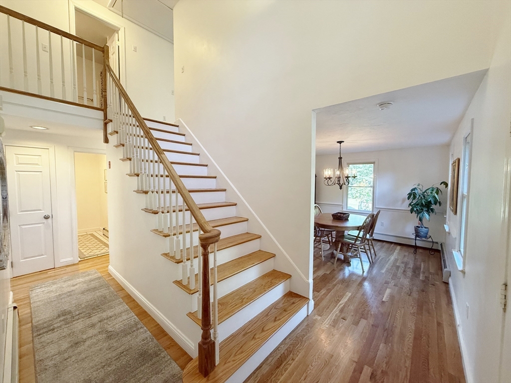 291 Harvard Road Bolton, MA 01740 - Photo 12 of 40 a view of entryway and hall with wooden floor