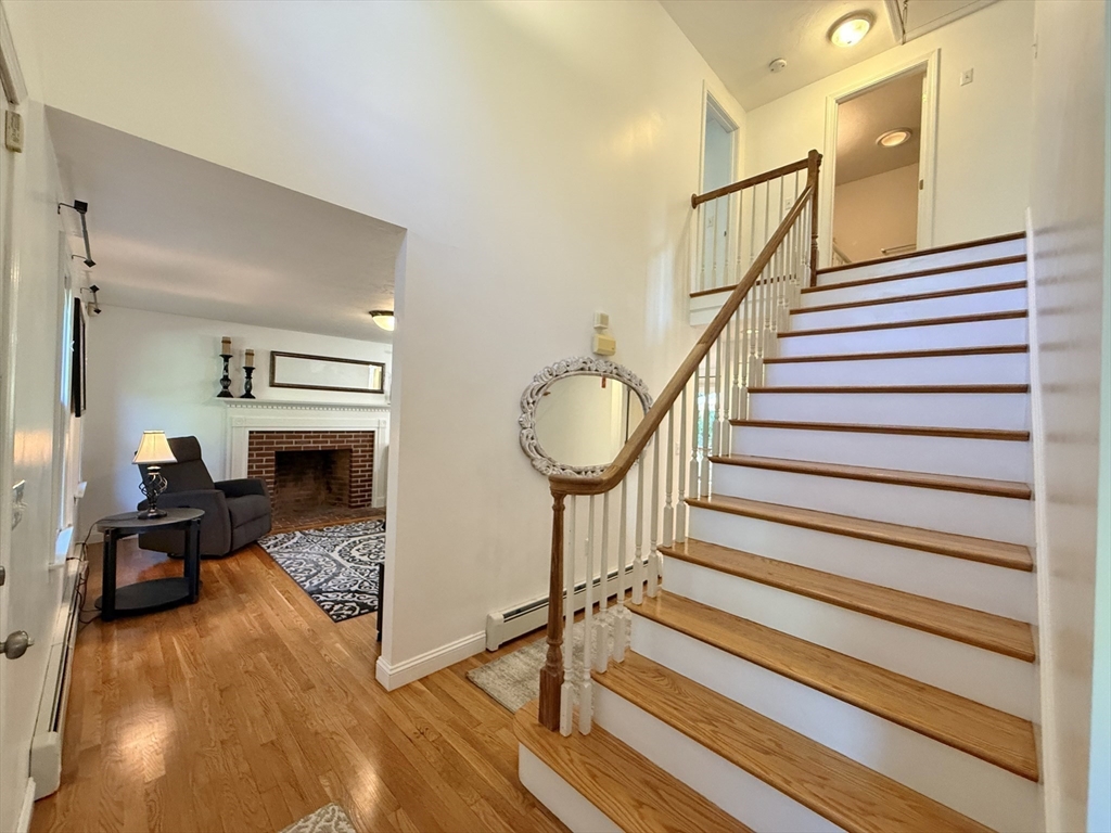 291 Harvard Road Bolton, MA 01740 - Photo 13 of 40 a view of entryway livingroom and hall with wooden floor