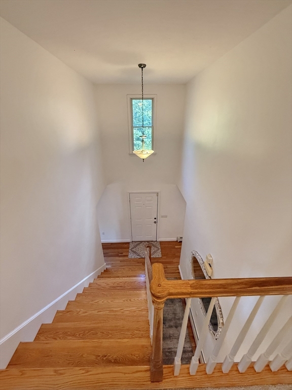 291 Harvard Road Bolton, MA 01740 - Photo 17 of 40 a front view of a house with outdoor space and a window