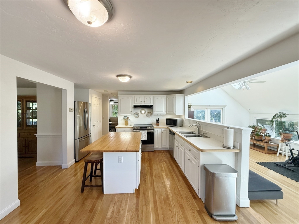 291 Harvard Road Bolton, MA 01740 - Photo 19 of 40 a large kitchen with lots of counter top space and stainless steel appliances