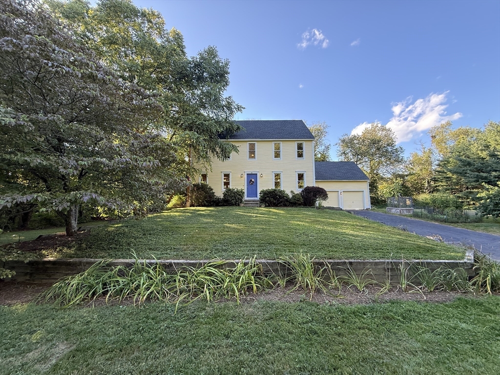 291 Harvard Road Bolton, MA 01740 - Photo 2 of 40 a view of a house with a yard