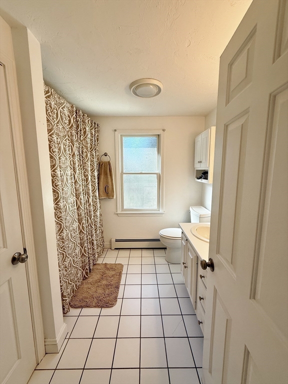 291 Harvard Road Bolton, MA 01740 - Photo 26 of 40 a bathroom with a sink a toilet and a shower