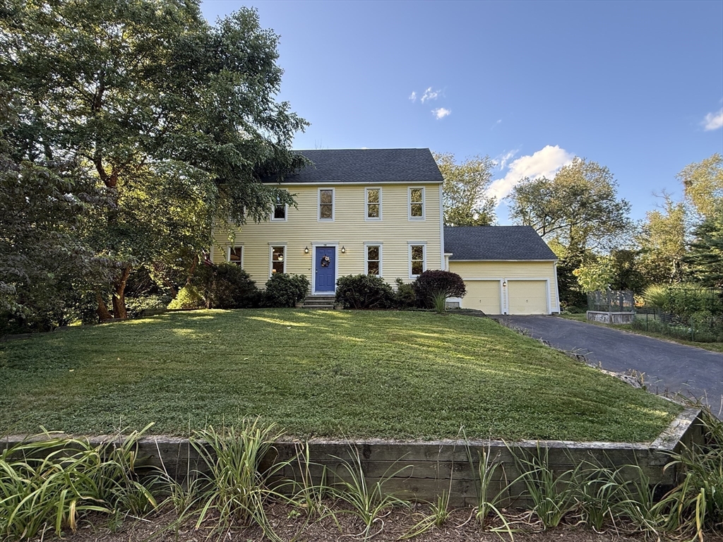 291 Harvard Road Bolton, MA 01740 - Photo 30 of 40 a front view of a house with garden