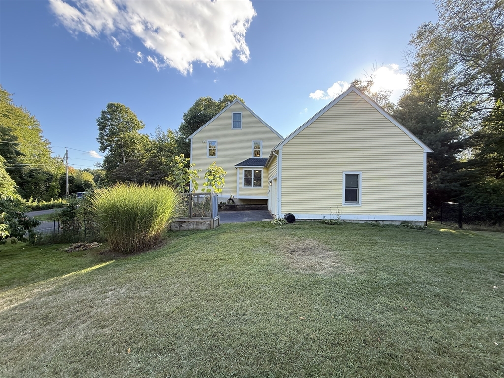 291 Harvard Road Bolton, MA 01740 - Photo 5 of 40 a view of a backyard with a garden