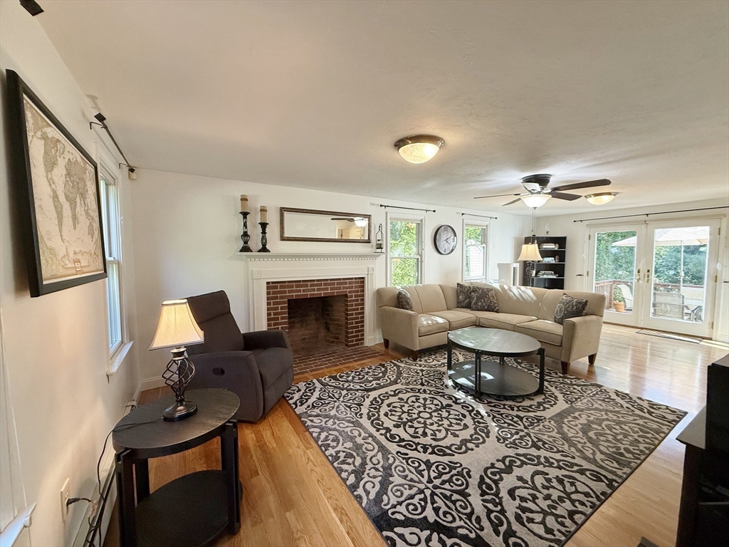 291 Harvard Road Bolton, MA 01740 - Photo 7 of 40 a living room with furniture and a fireplace