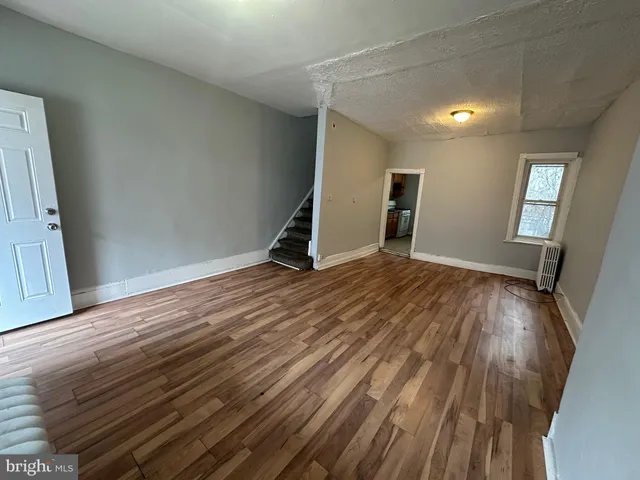 a view of a livingroom with wooden floor
