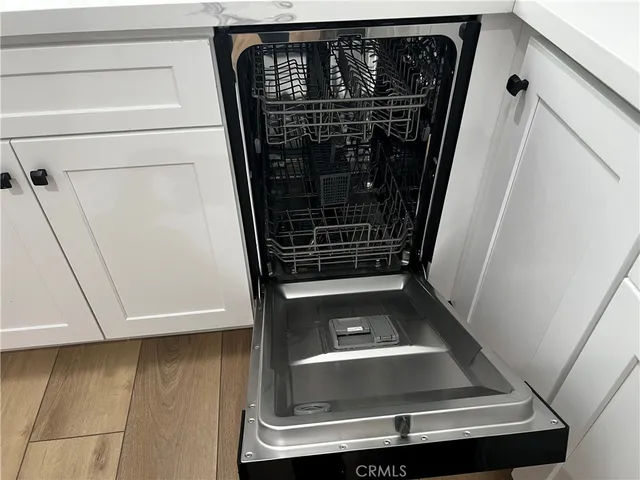 a white refrigerator freezer sitting in a kitchen