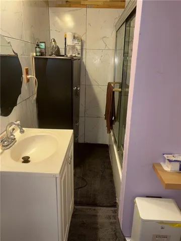 a bathroom with a sink a toilet and a tub