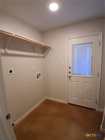 a view of storage and utility room with closet