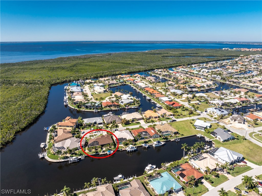Undisclosed Address Punta Gorda, FL 33950 - Photo 1 of 1 an aerial view of a house with a ocean view