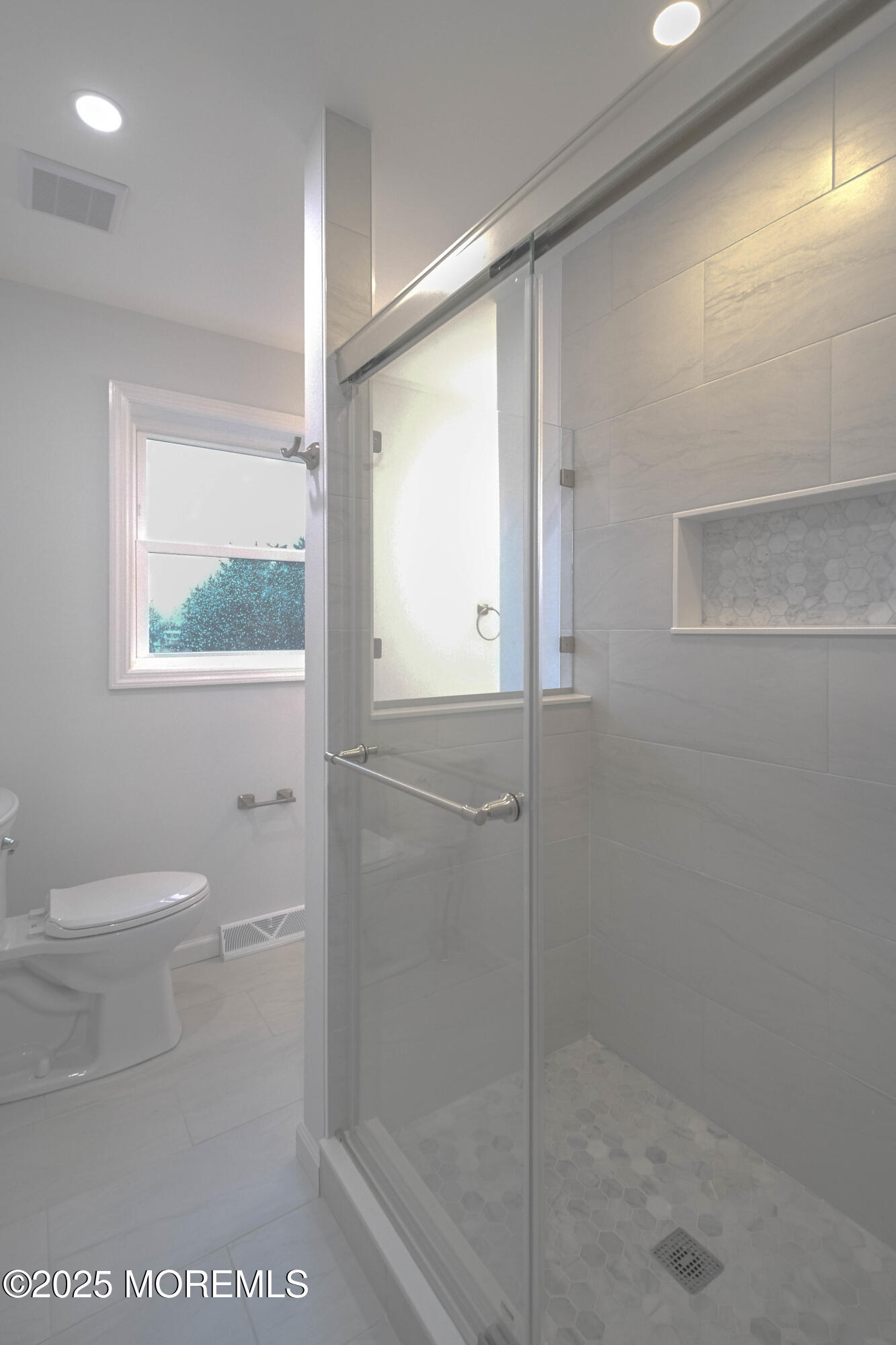 125 Shore Road Marmora, NJ 08223 - Photo 18 of 26 a bathroom with a shower a toilet and a window