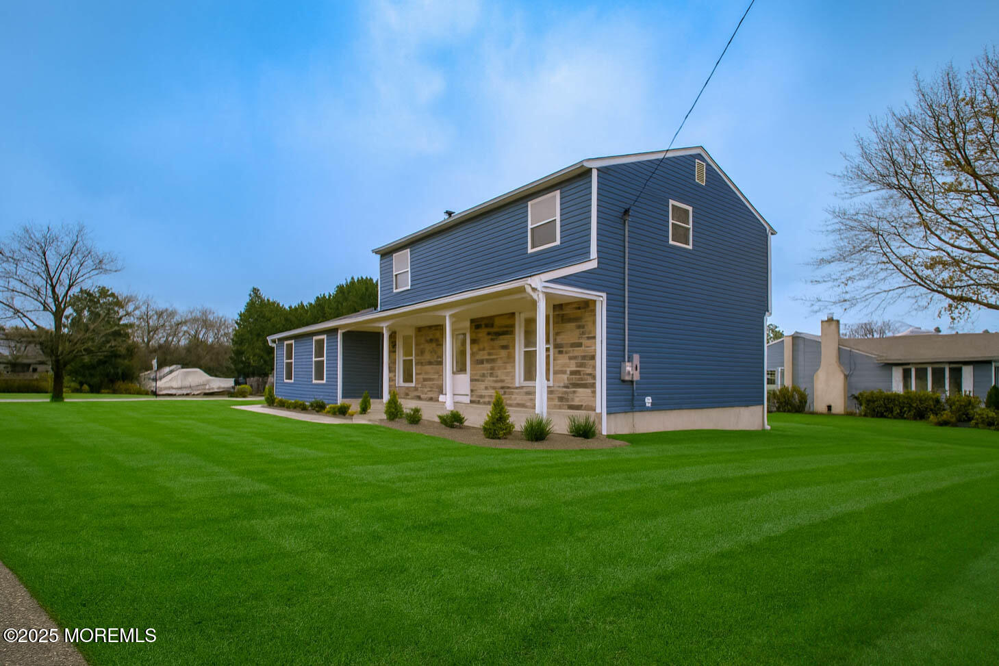 125 Shore Road Marmora, NJ 08223 - Photo 2 of 26 a front view of house with yard and green space