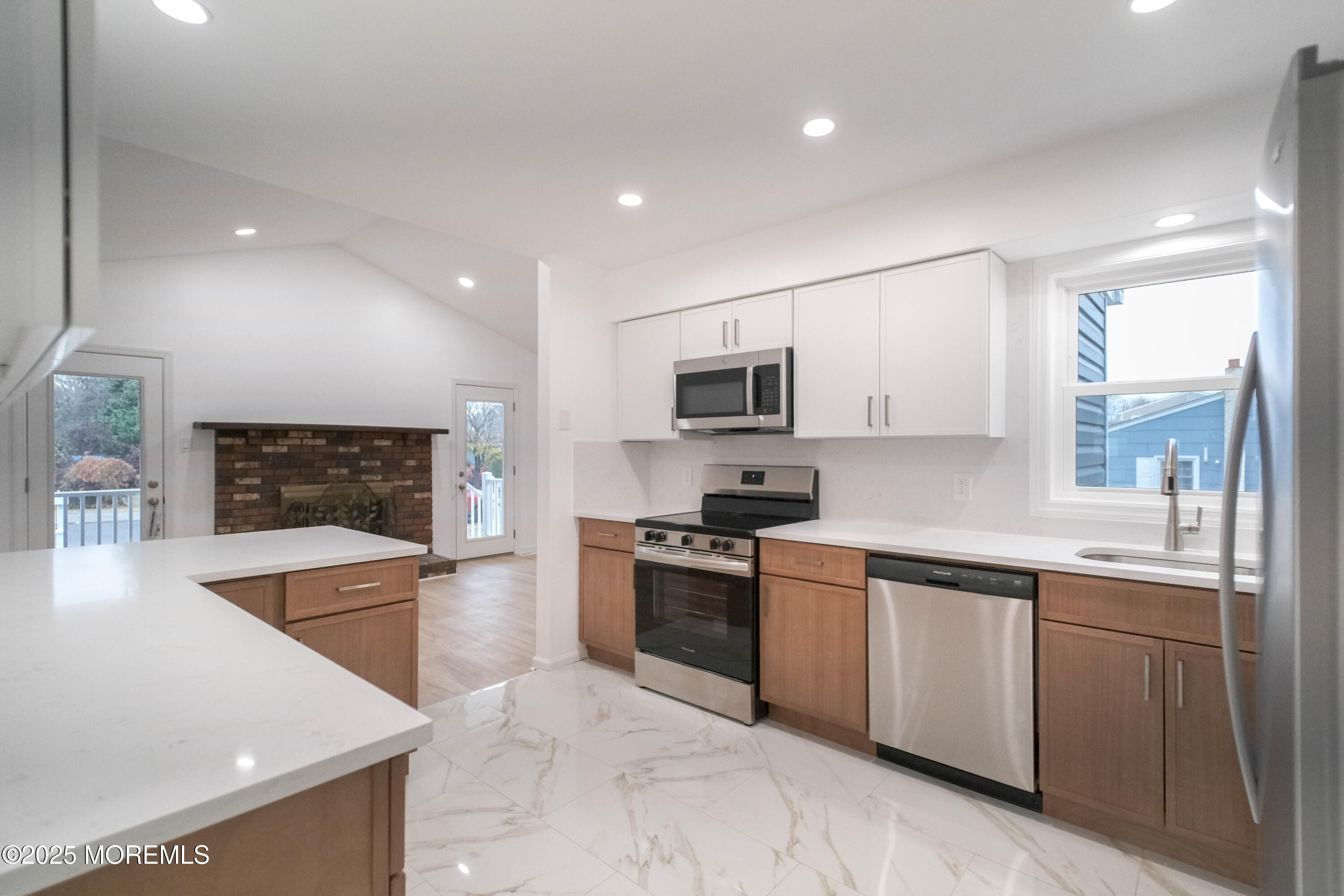 125 Shore Road Marmora, NJ 08223 - Photo 7 of 26 a large kitchen with stainless steel appliances granite countertop a sink and a stove