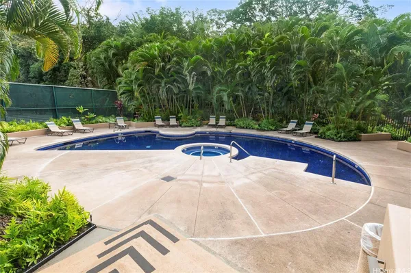 a view of a swimming pool with a patio