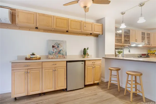 a kitchen with stainless steel appliances granite countertop a sink dishwasher and cabinets with wooden floor