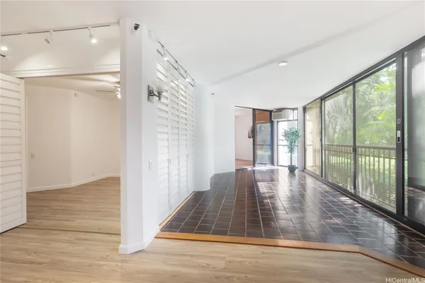 a view of livingroom with floor to ceiling window
