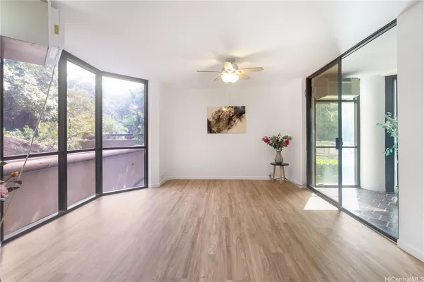 wooden floor in an empty room with a window