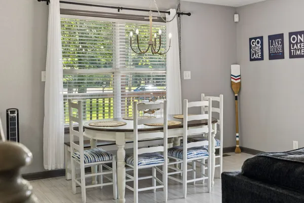 a dining room with furniture and window