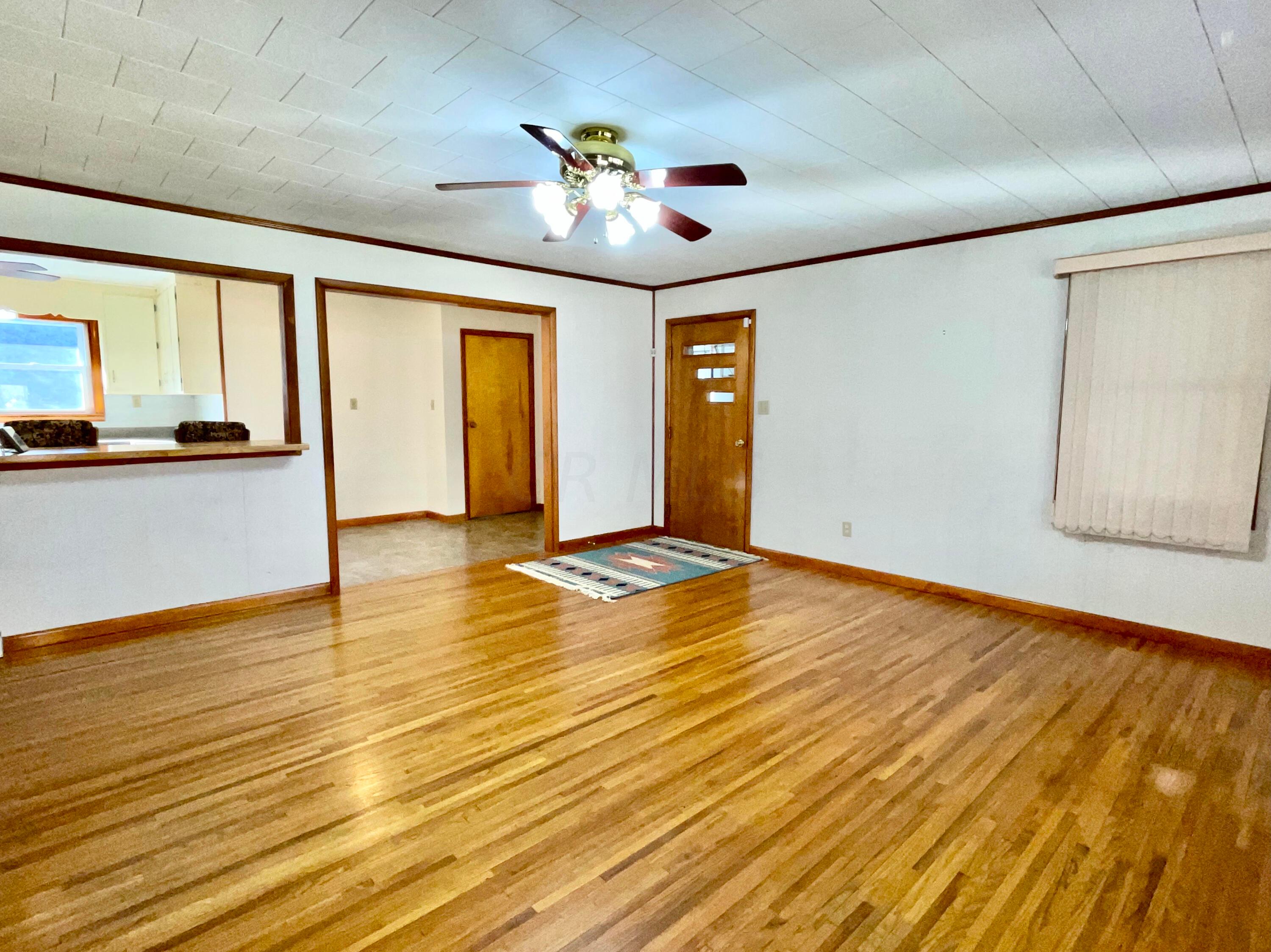 1368 Allen Road Beaver, OH 45613 - Photo 33 of 77 Another view of the living room. Door with windows to the garage. Other door is to the finished basement.