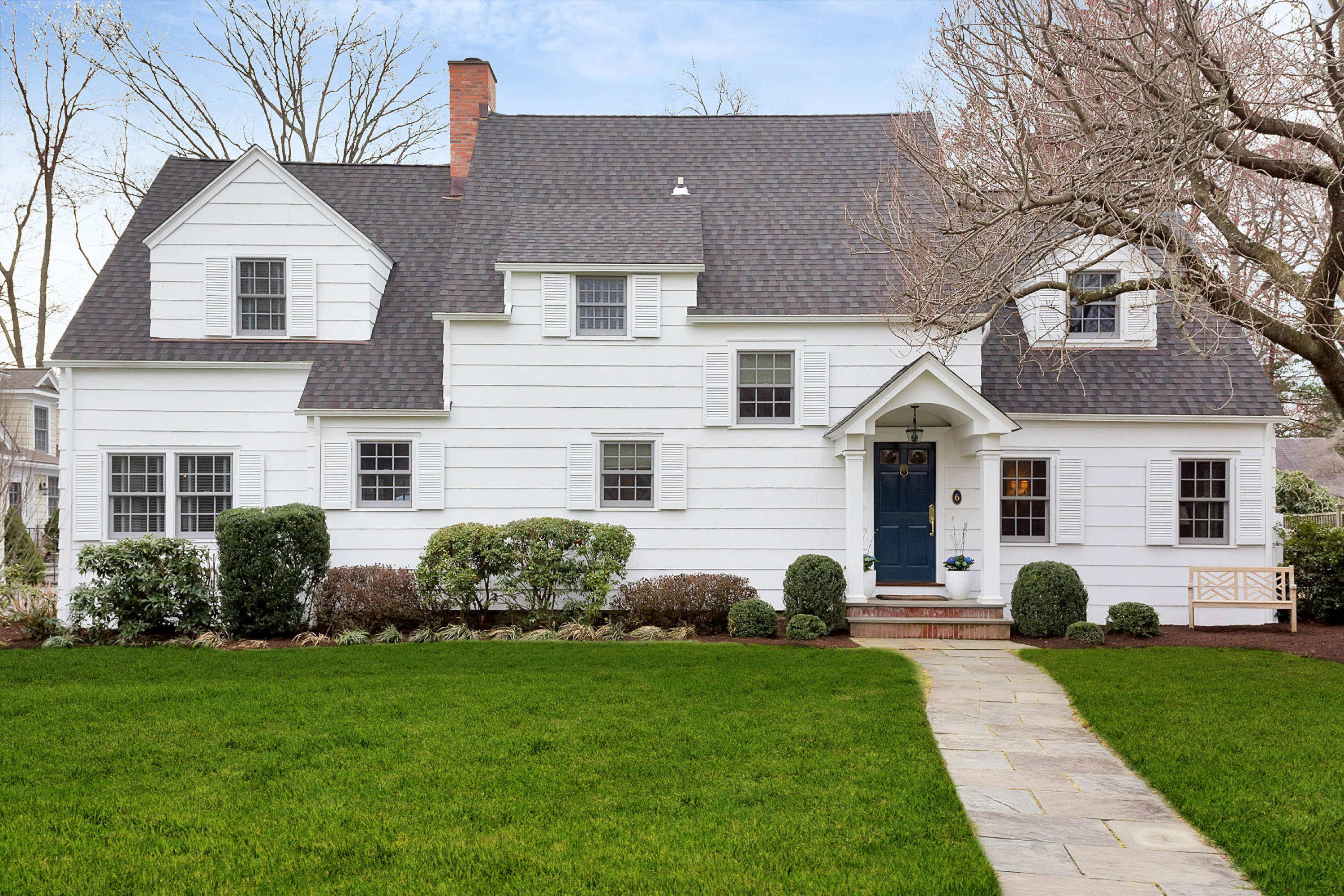 6 Sunset Road Darien, CT 06820 - Photo 1 of 24 a view of a white house with a yard and plants