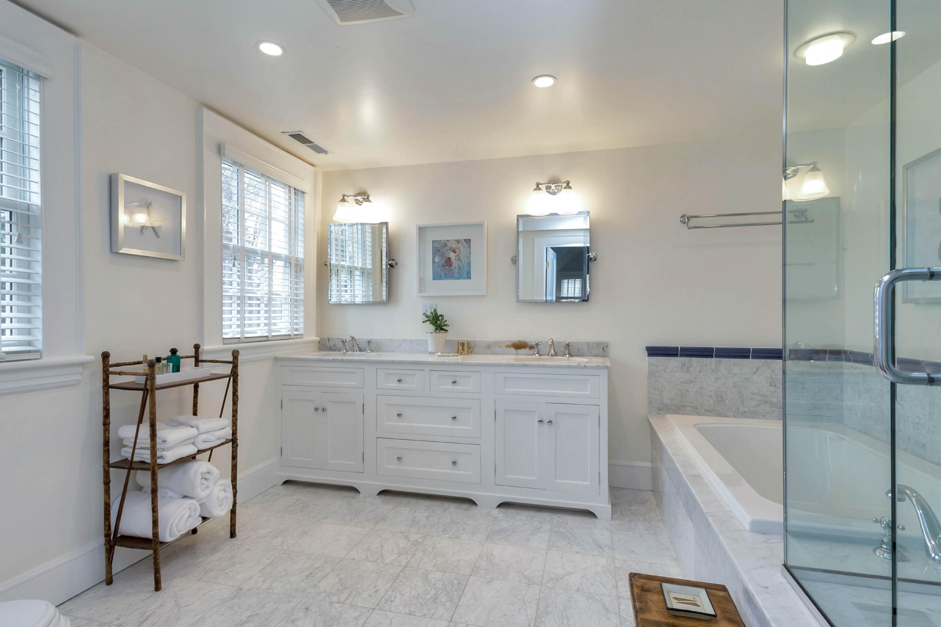 6 Sunset Road Darien, CT 06820 - Photo 19 of 24 a bathroom with a granite countertop sink mirror and bathtub