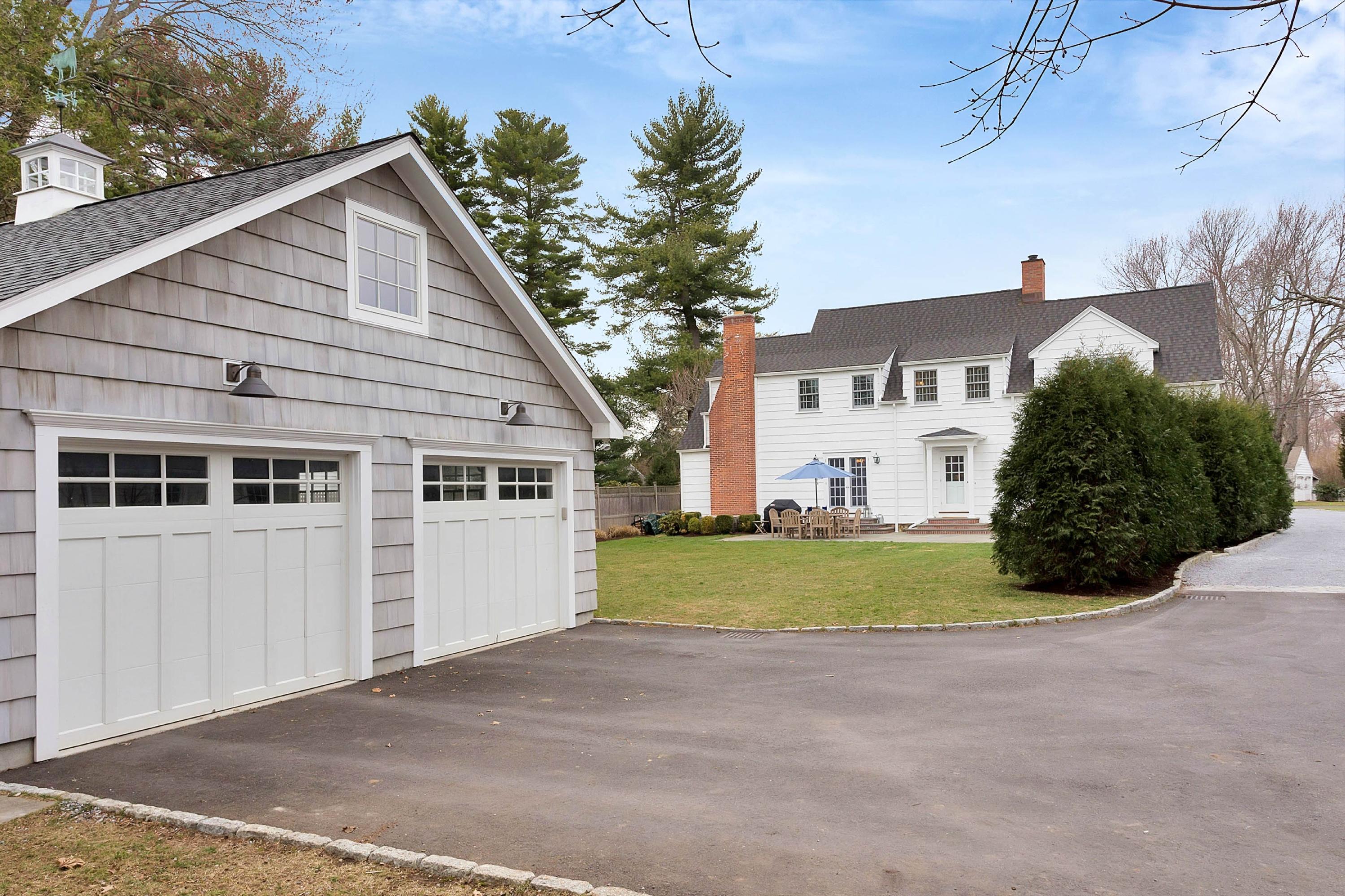 6 Sunset Road Darien, CT 06820 - Photo 23 of 24 a view of a house with a yard and garage