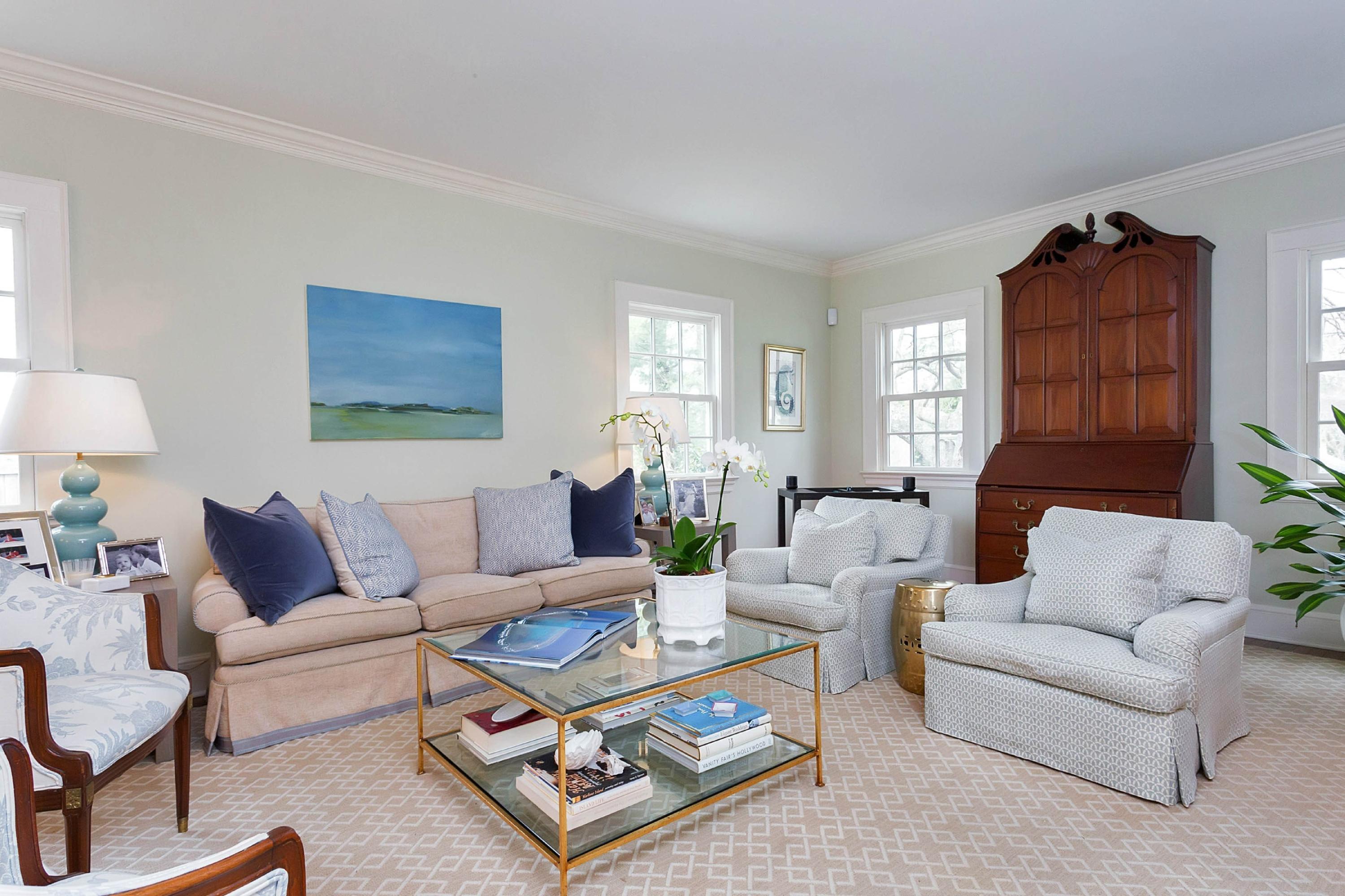 6 Sunset Road Darien, CT 06820 - Photo 4 of 24 a living room with furniture a lamp paintings and a window