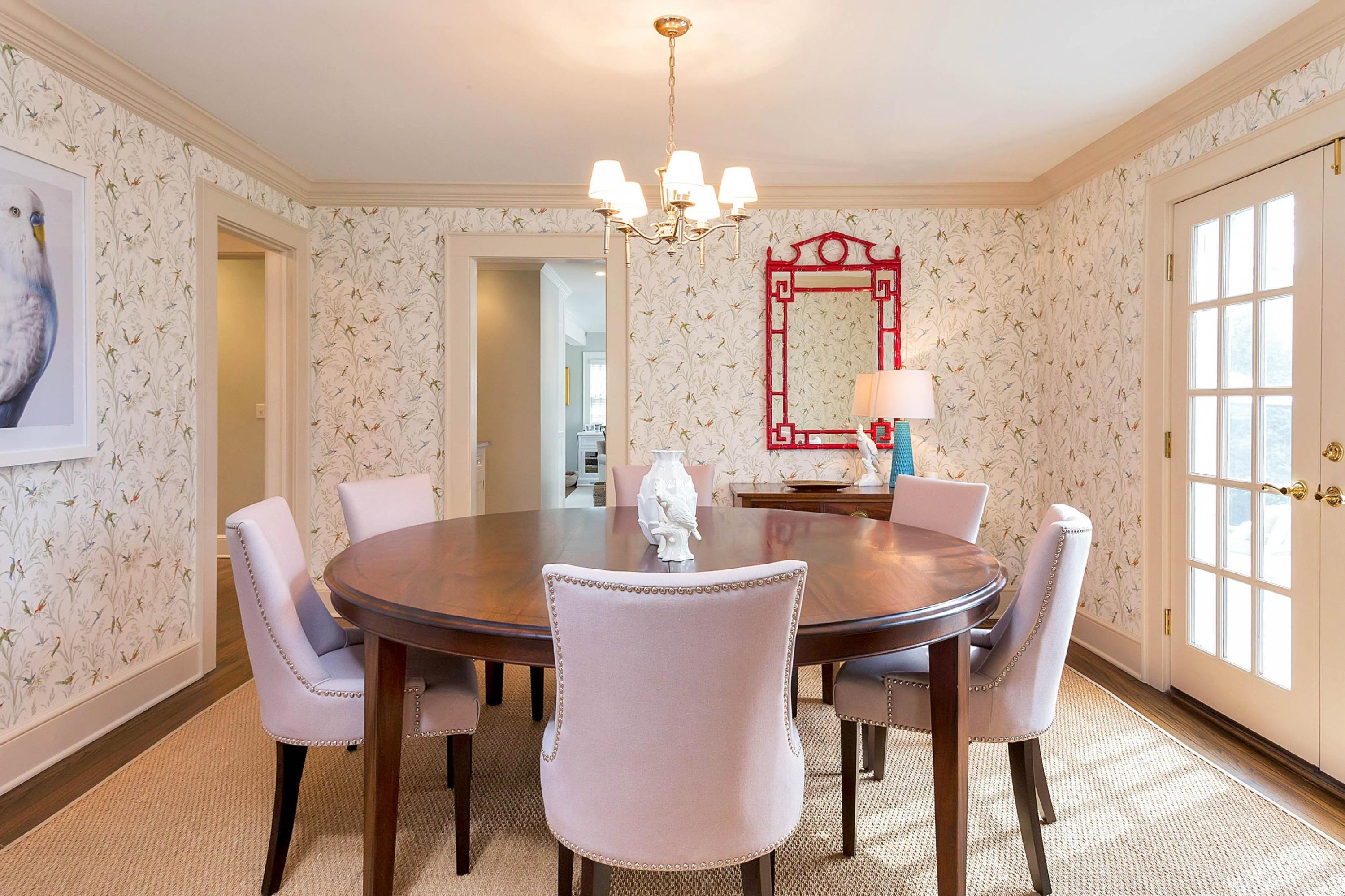 6 Sunset Road Darien, CT 06820 - Photo 6 of 24 a dining room with furniture a chandelier and wooden floor